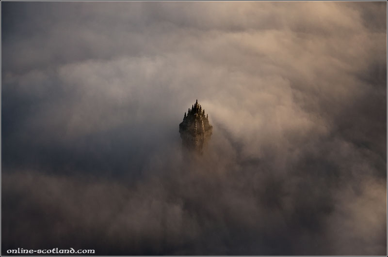 The Wallace Monument peaking through low cloud
